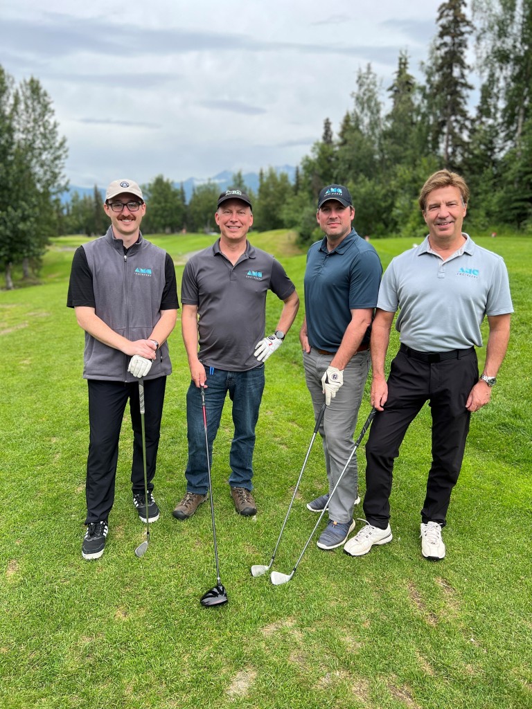 Ken and three other AMC employees golfing