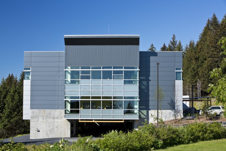 Multistory building with garage entrance under it