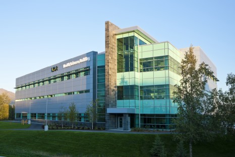 Exterior of multistory building with large glass windows and tiled walls