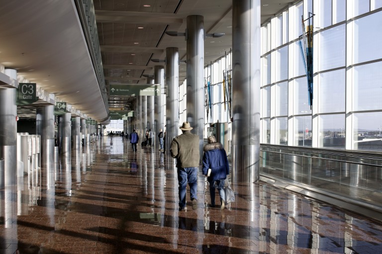 Walkway in airport with large windows