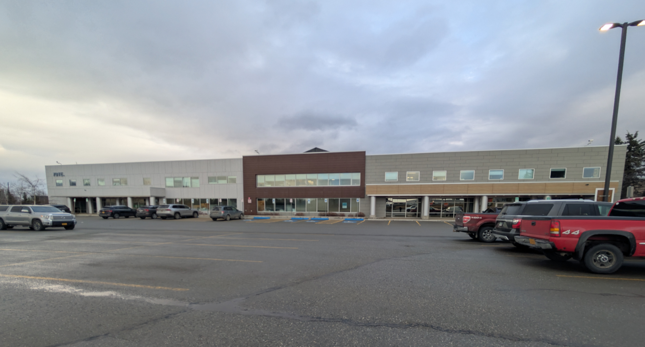 Large two story concrete and red brick building