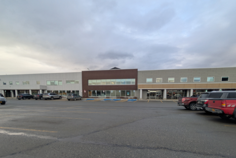 Large two story concrete and red brick building
