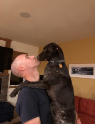 Man holding a dog