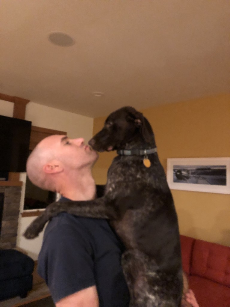 Man holding a dog
