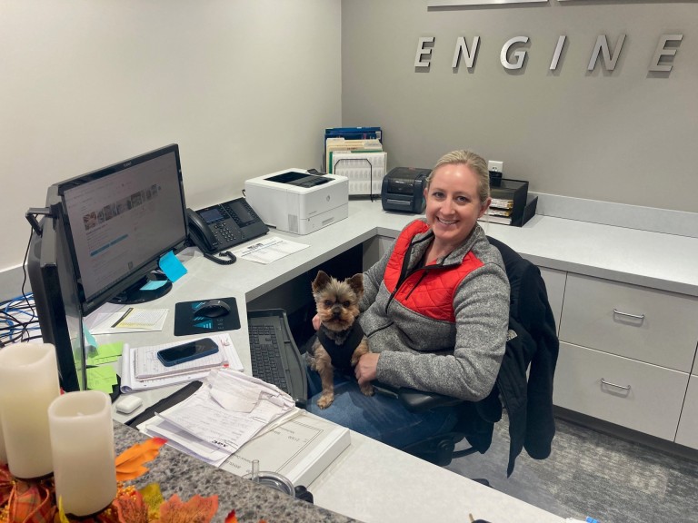 Brittany sitting with Teddy the Yorkshire Terrier